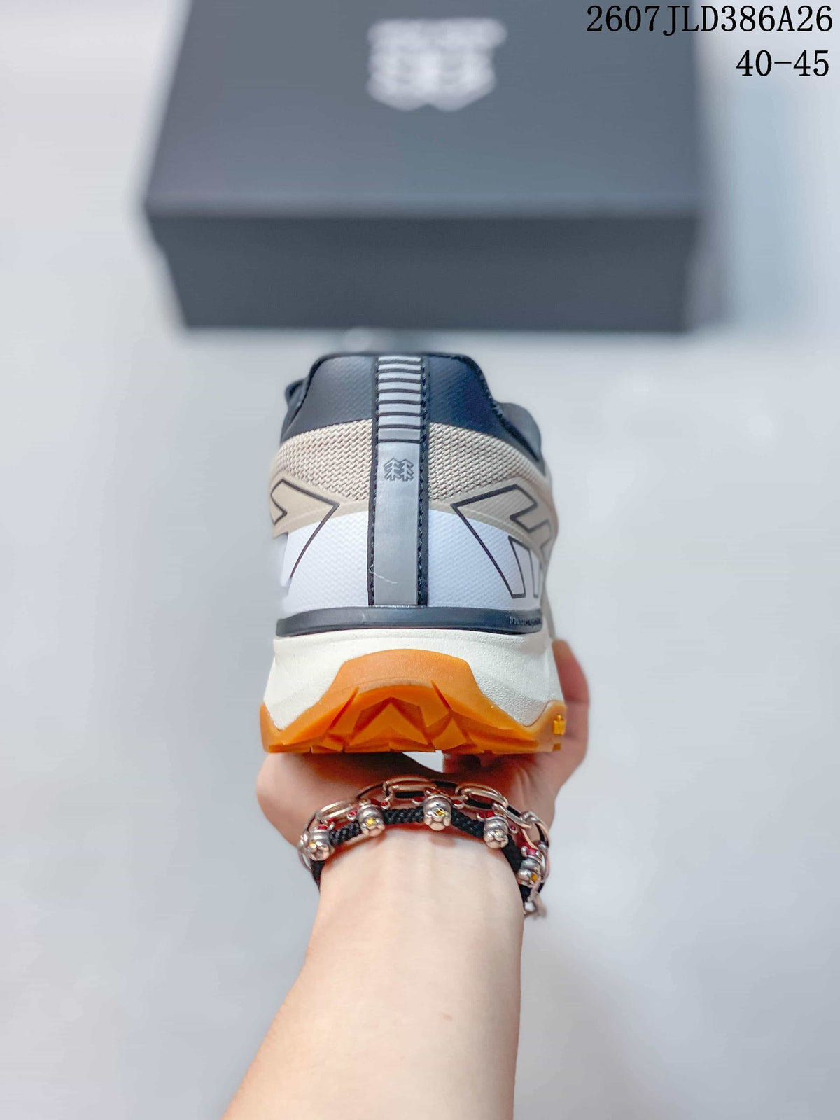 Rear view showing the padded heel collar, layered heel design and amber outsole.