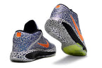 Patterned blue, white, and orange Nike GT Hustle 3 shoes shown from the heel and outsole.
