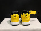 Rear view of the pair showing yellow heel panels, black collar lining, and contrasting heel graphics.