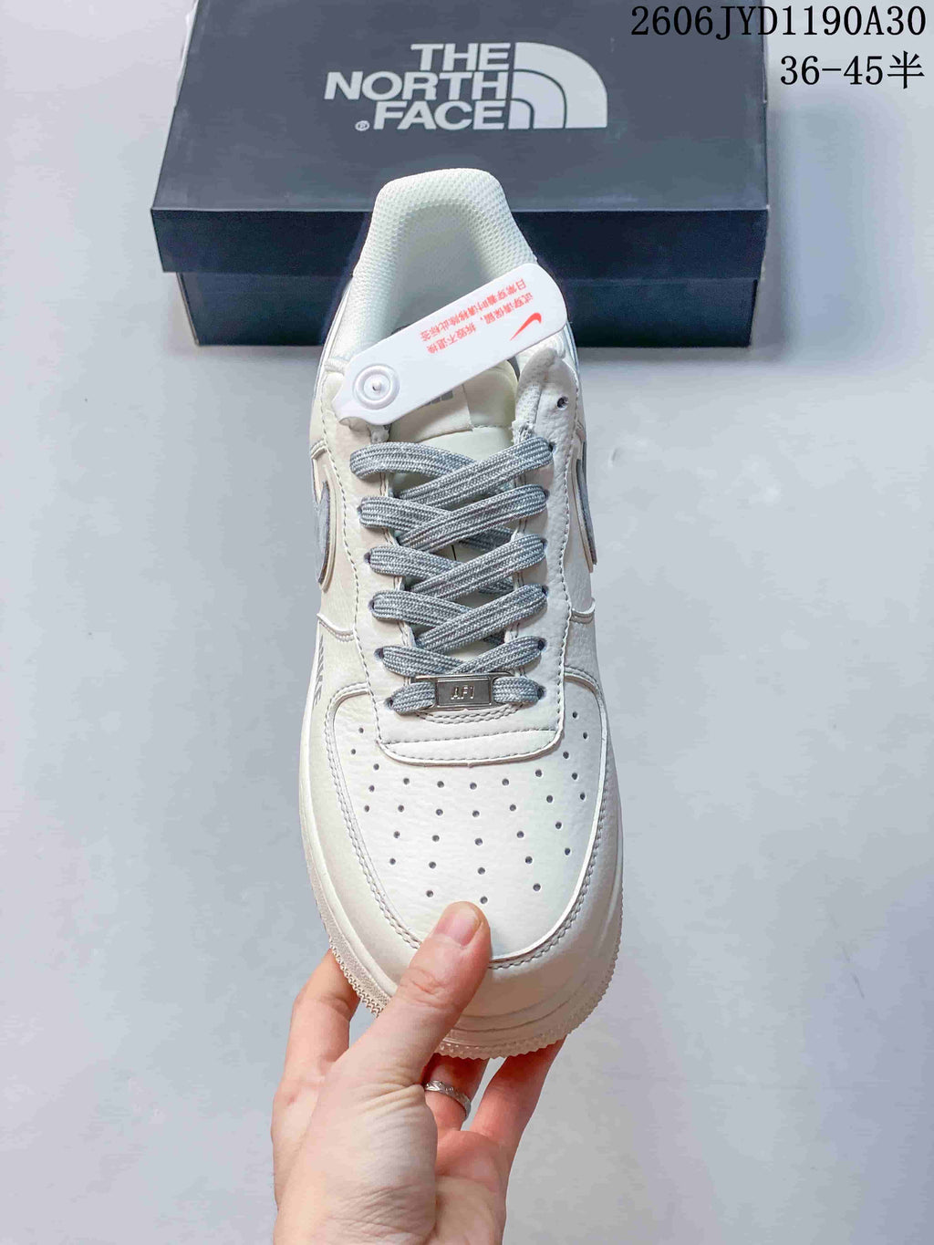 Top view of the sneaker with gray laces and a perforated toe panel