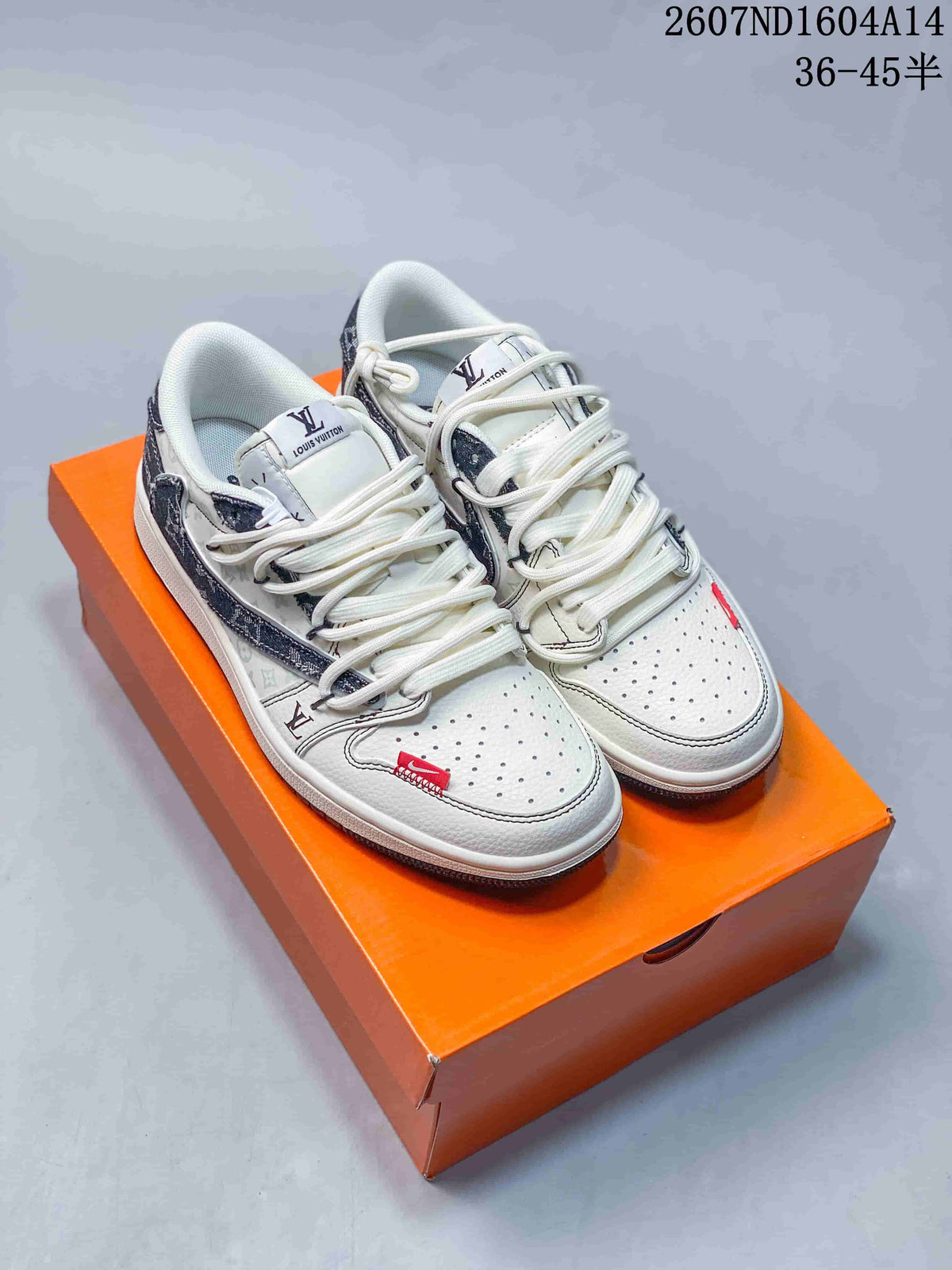 Pair of white and grey low-top sneakers displayed on an orange box, showing patterned panels, perforated toe boxes, and white laces.