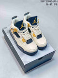 Pair of off-white Jordan Air Jordan 4 Retro sneakers with navy and gold accents displayed on a shoebox.