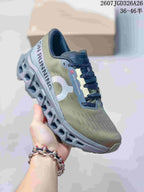 Angled side view of the olive and gray sneaker showing the On side logo, running graphics, laces, and sculpted sole.