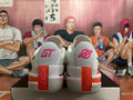 Rear view of white Nike basketball shoes with pink and orange heel details