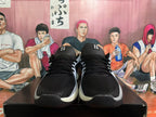 Front view of black lace-up sneakers with silver accents