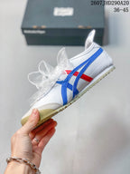 Side profile showing the white upper, blue and red stripes, ribbon-style laces, and low-top shape.