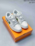 Pair of white and gray low-top sneakers with green side overlays displayed on an orange box; image text shows style code 2607JVD1158A18 and sizes 36–45.