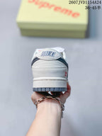 Rear view of the sneaker showing the padded heel, Nike branding and gray outsole edge.