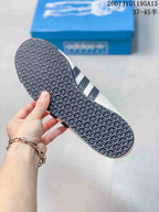 Close-up of the sneaker outsole showing a dense geometric tread pattern.