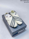 Pair of off-white adidas sneakers with navy stripes displayed on a shoebox; size range text is visible at the top.