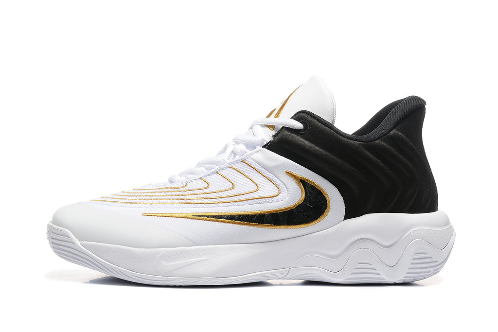 Side view of a white Nike Zoom Freak 5 basketball shoe with black and gold accents