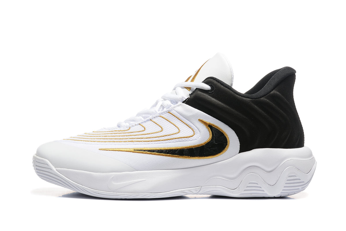 Side view of a white Nike Zoom Freak 5 basketball shoe with black and gold accents