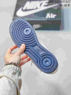 Outsole view showing the blue circular traction pattern and Air branding.