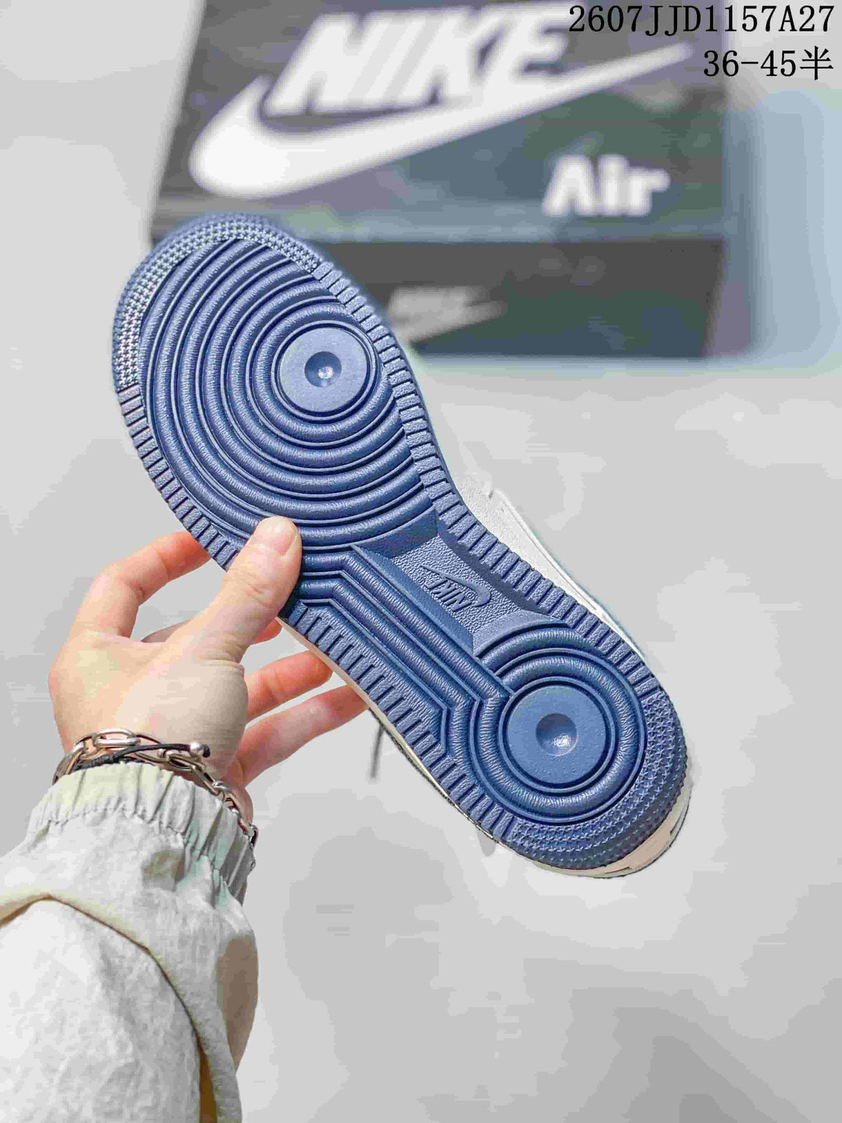 Outsole view showing the blue circular traction pattern and Air branding.