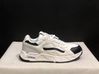 Single side profile of the sneaker showing the white upper, black toe and side accents, and branded side detail.