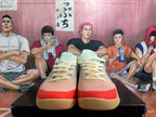 Front view of the lace-up basketball shoes with cream laces, coral toe accents, and gum-colored outsoles.