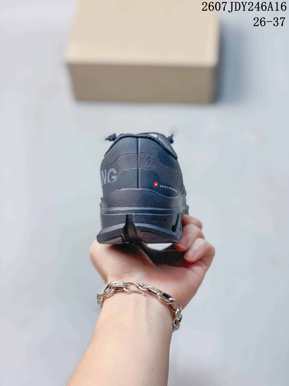 Rear view of the dark gray sneaker showing the padded heel area and layered sole.