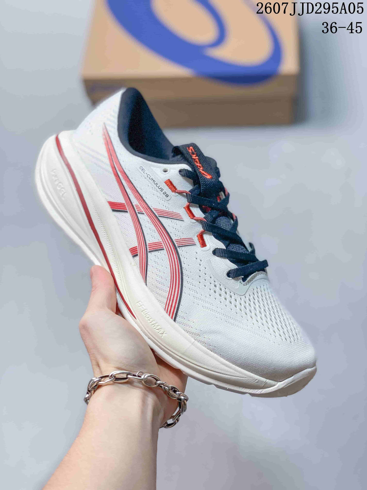 White ASICS running shoe with red accents, dark laces, and a white outsole.