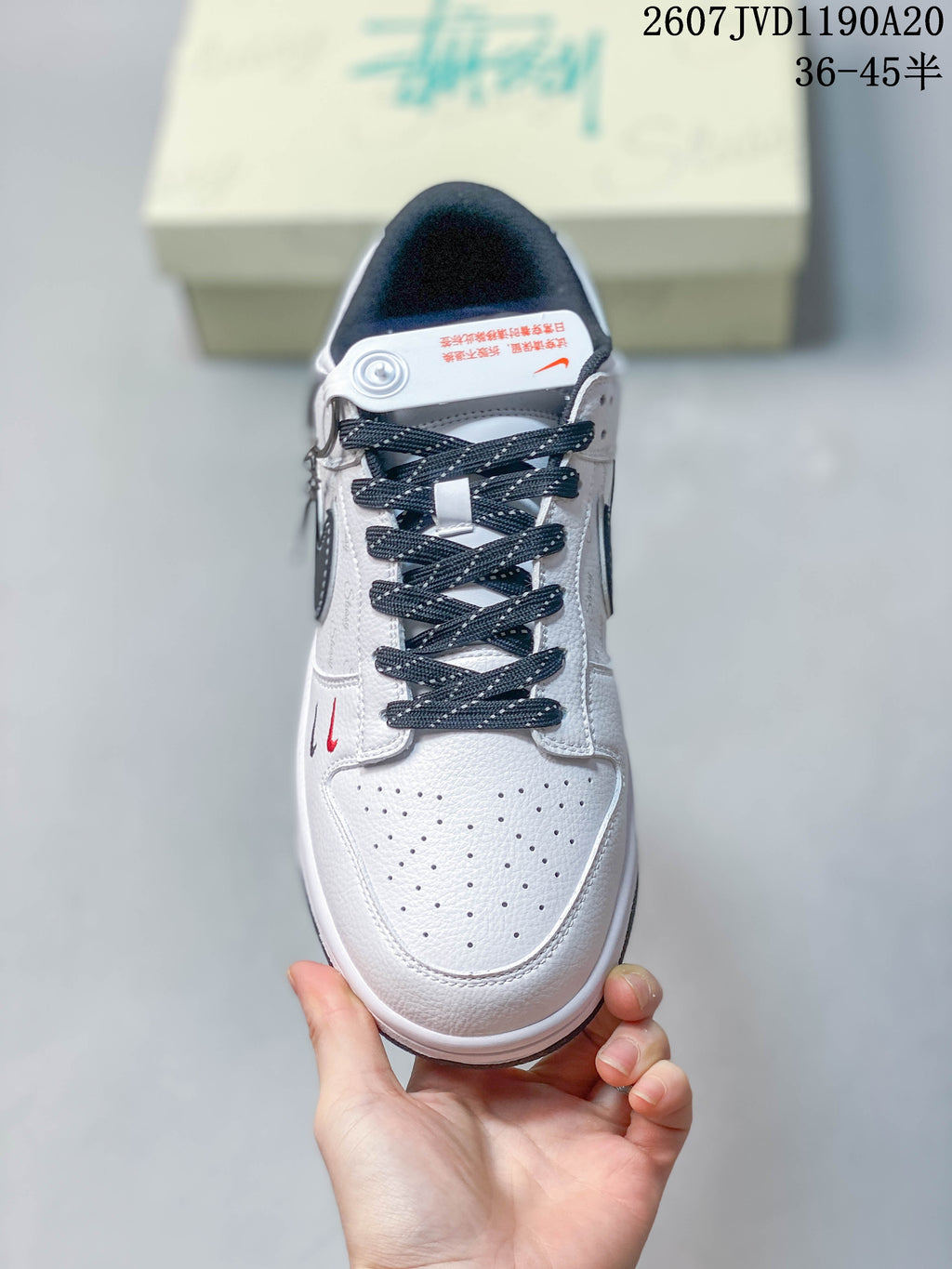 Top view of the sneaker showing the perforated white toe box, dark laces, padded tongue, and contrast detailing.