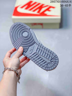 Close-up of the gray textured rubber outsole with circular traction patterns and Nike branding.