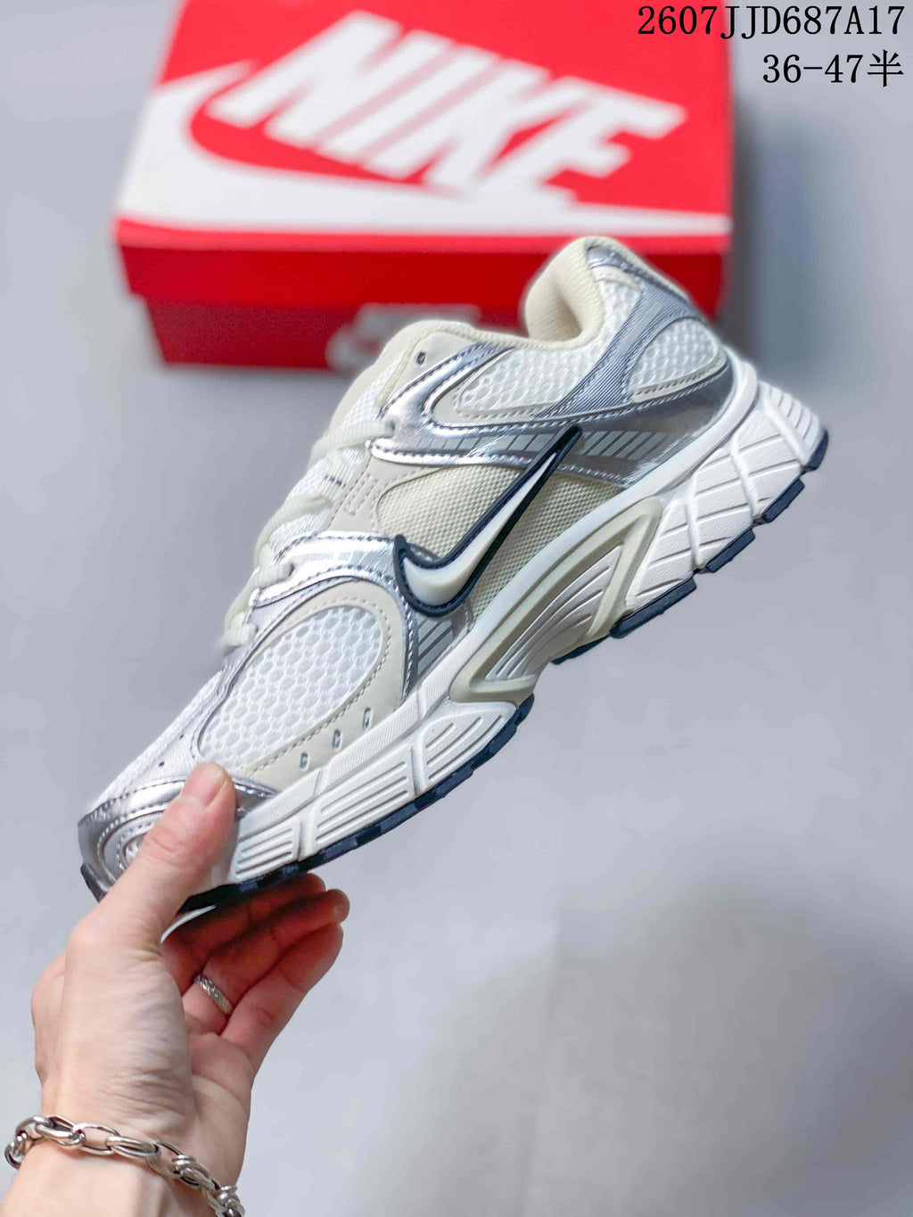 Side profile highlighting the mesh panels, layered overlays, Nike branding and segmented outsole.
