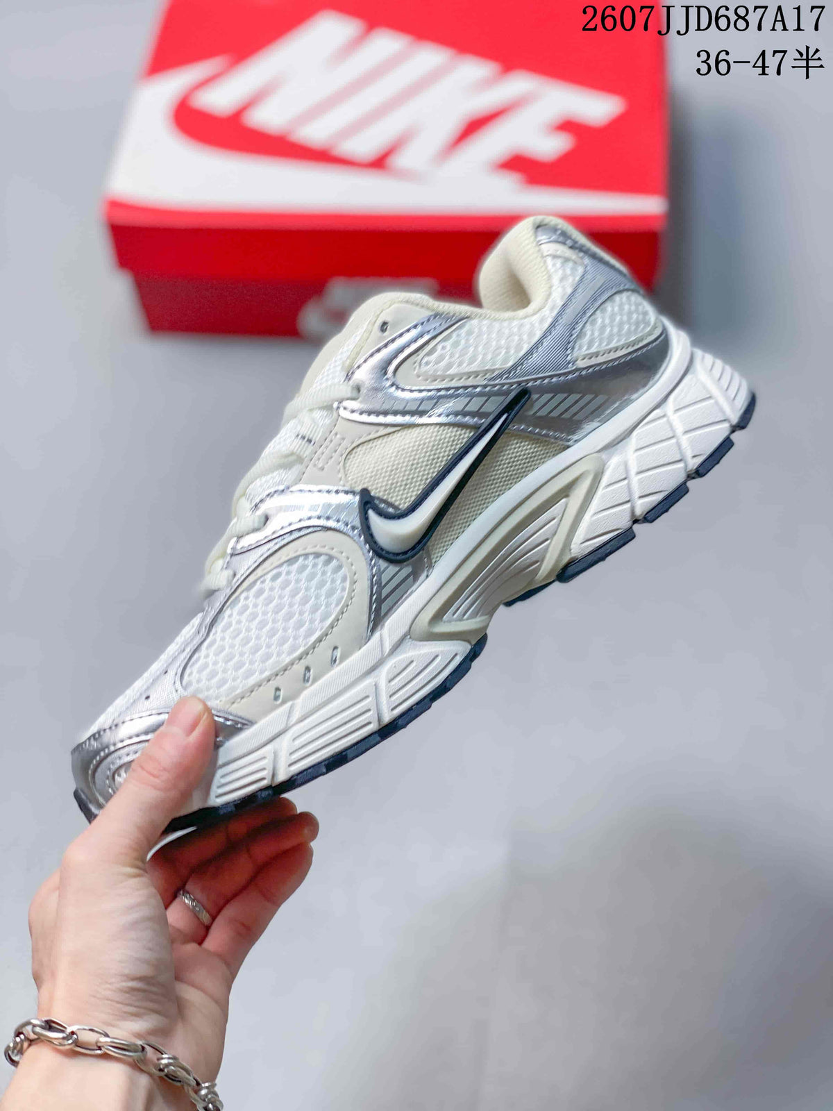 Side profile highlighting the mesh panels, layered overlays, Nike branding and segmented outsole.