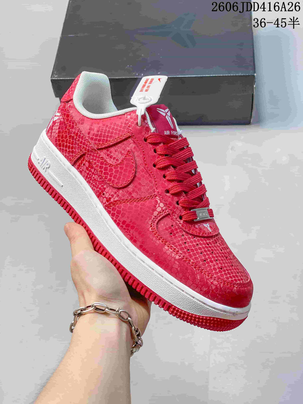 Angled view of a red patterned Nike Air Force 1 '07 low-top sneaker