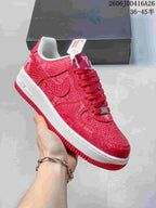 Angled view of a red patterned Nike Air Force 1 '07 low-top sneaker