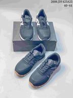 Several views of navy AX low-top sneakers with mesh panels and contrasting outsoles.