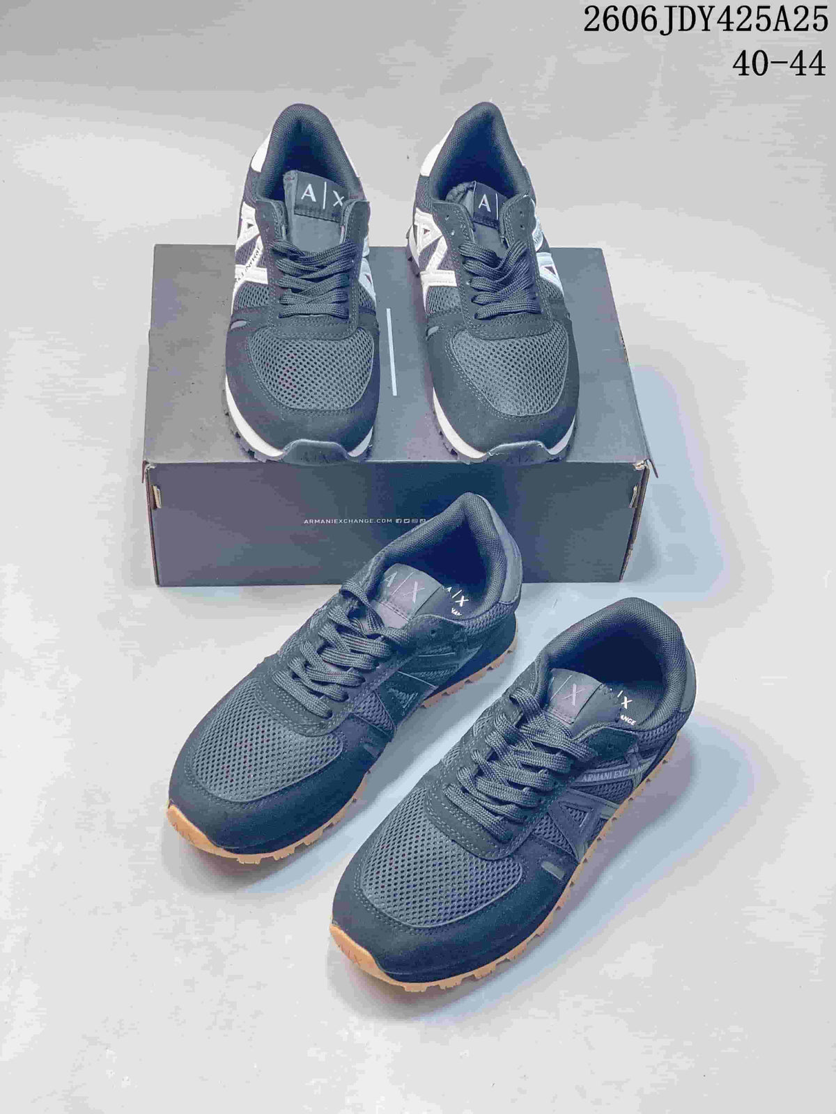 Several views of navy AX low-top sneakers with mesh panels and contrasting outsoles.
