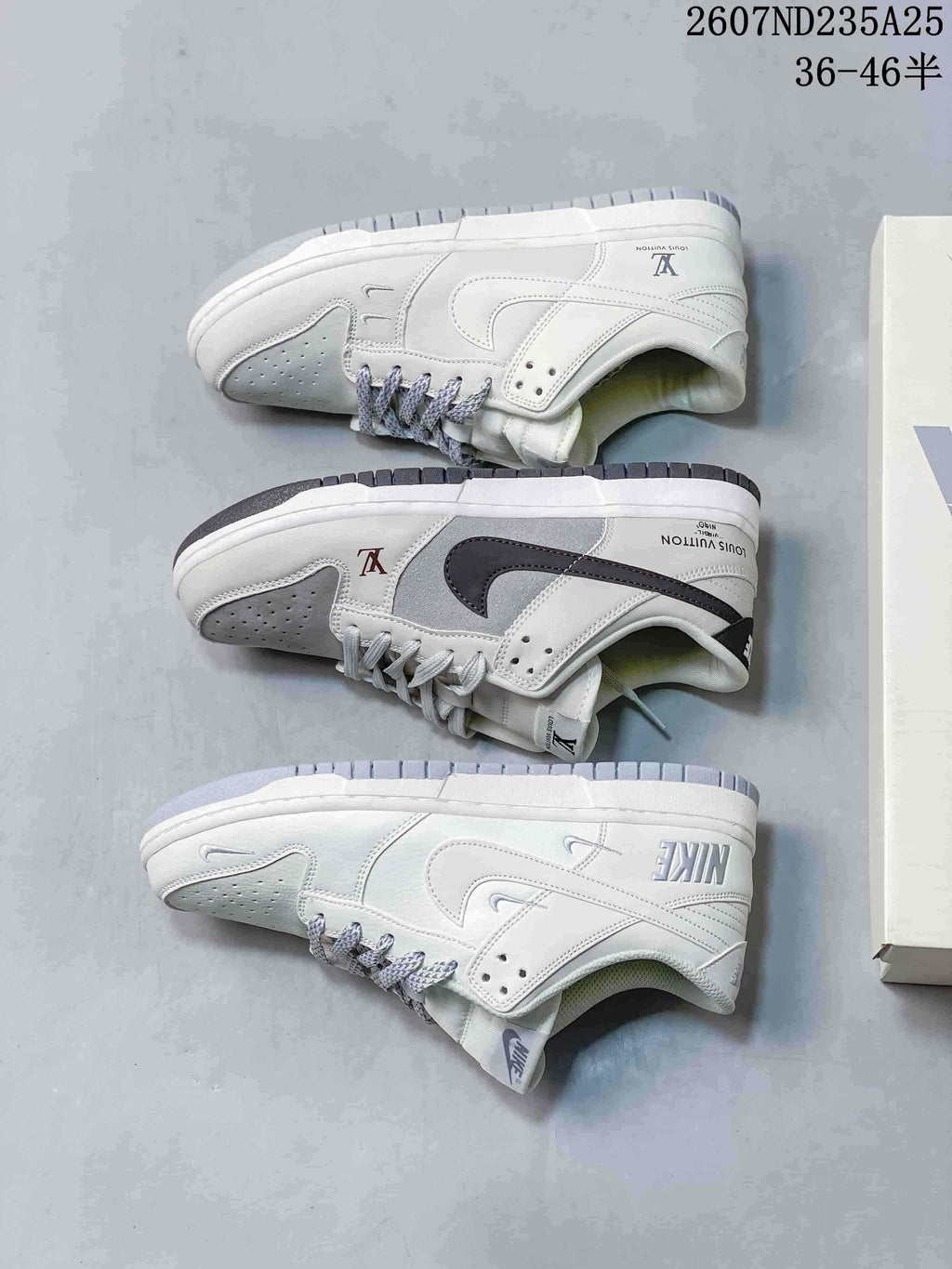 Three low-top sneakers shown from the side, illustrating white and grey panels, contrasting Swoosh-style details and branded heel areas.