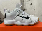 Side view of a white Nike HyperBet basketball shoe with black Swoosh, printed strap, and gum outsole.