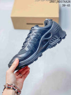 Side view of a black ECCO sneaker showing layered panels, mesh sections, lace-up construction and a lugged sole.
