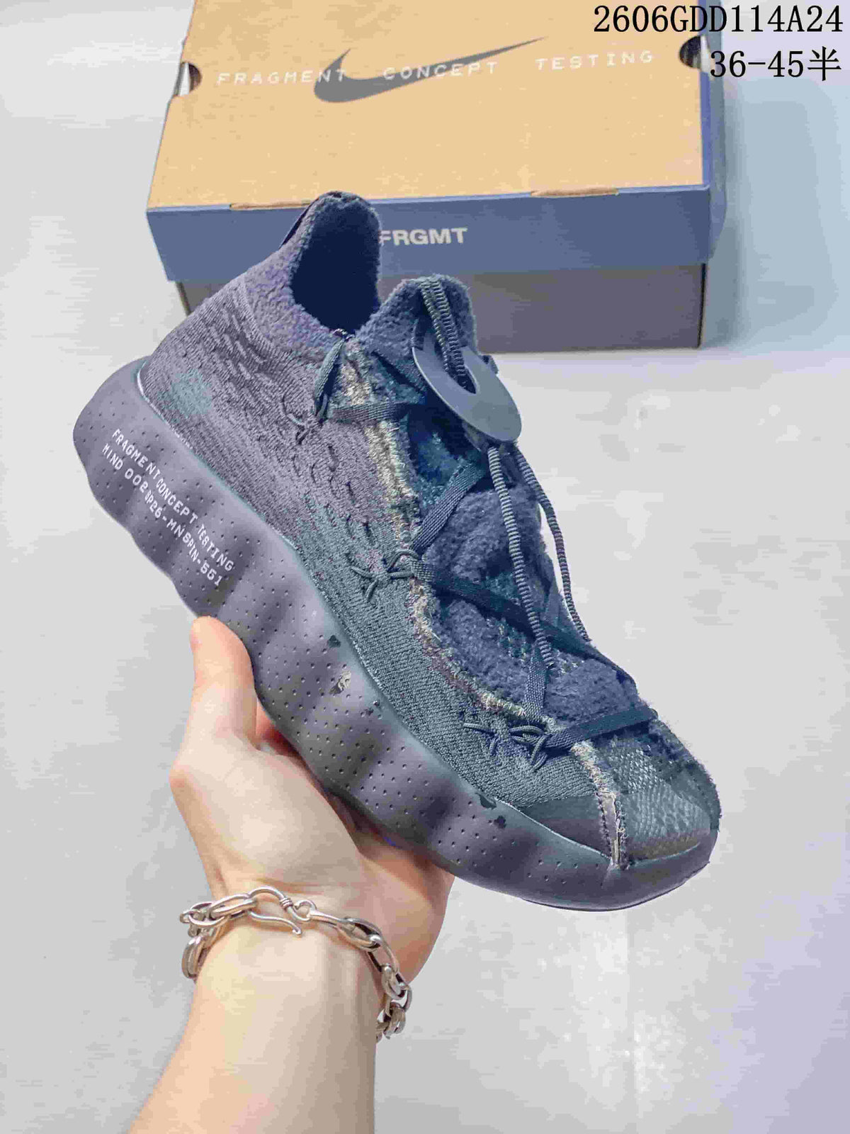 Angled view of the dark gray shoe with blue outsole accents