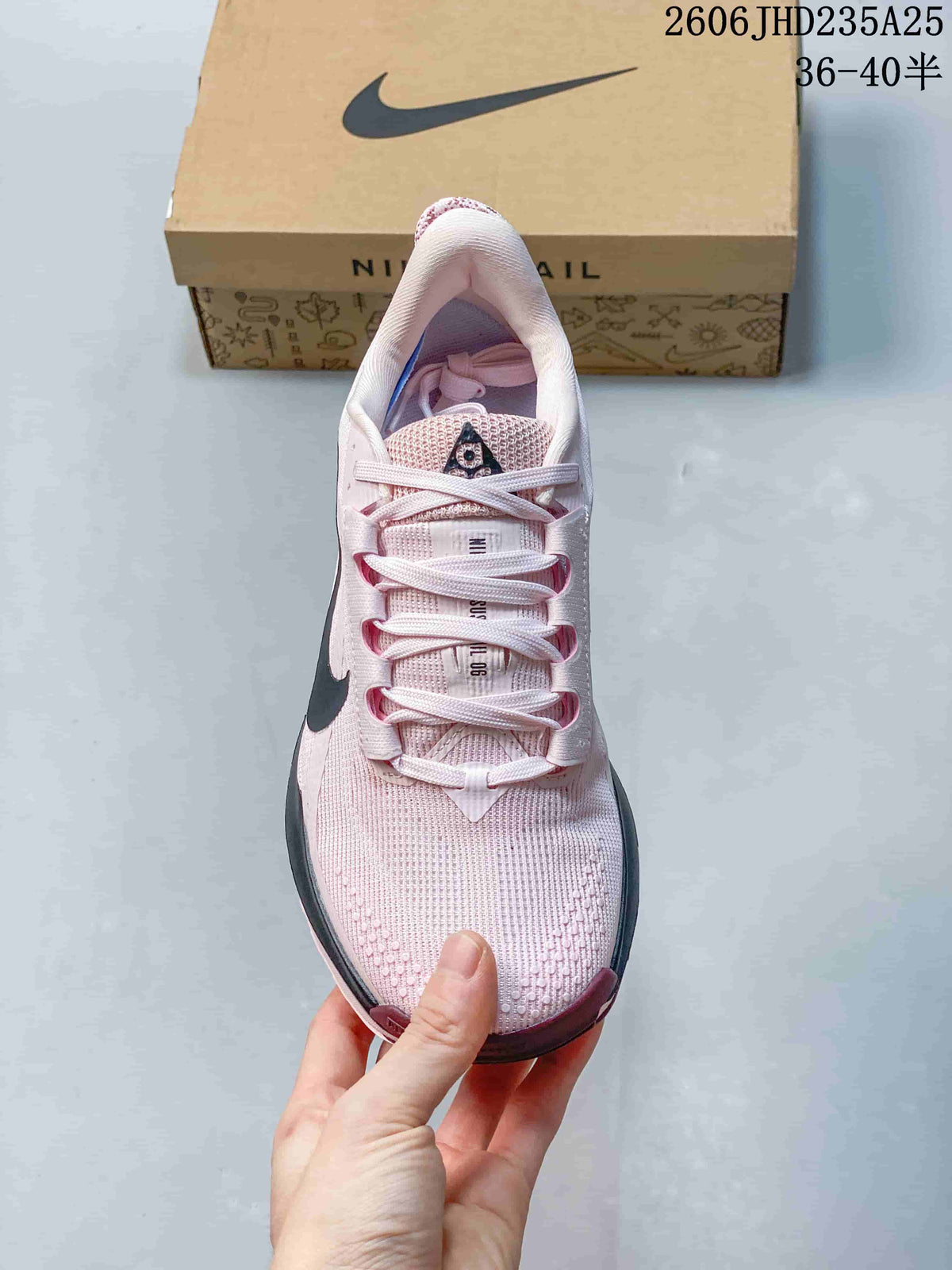 Top view showing laces and the textured pale pink upper