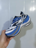Blue, white, black and gray Balenciaga sneaker shown from an angled side view.