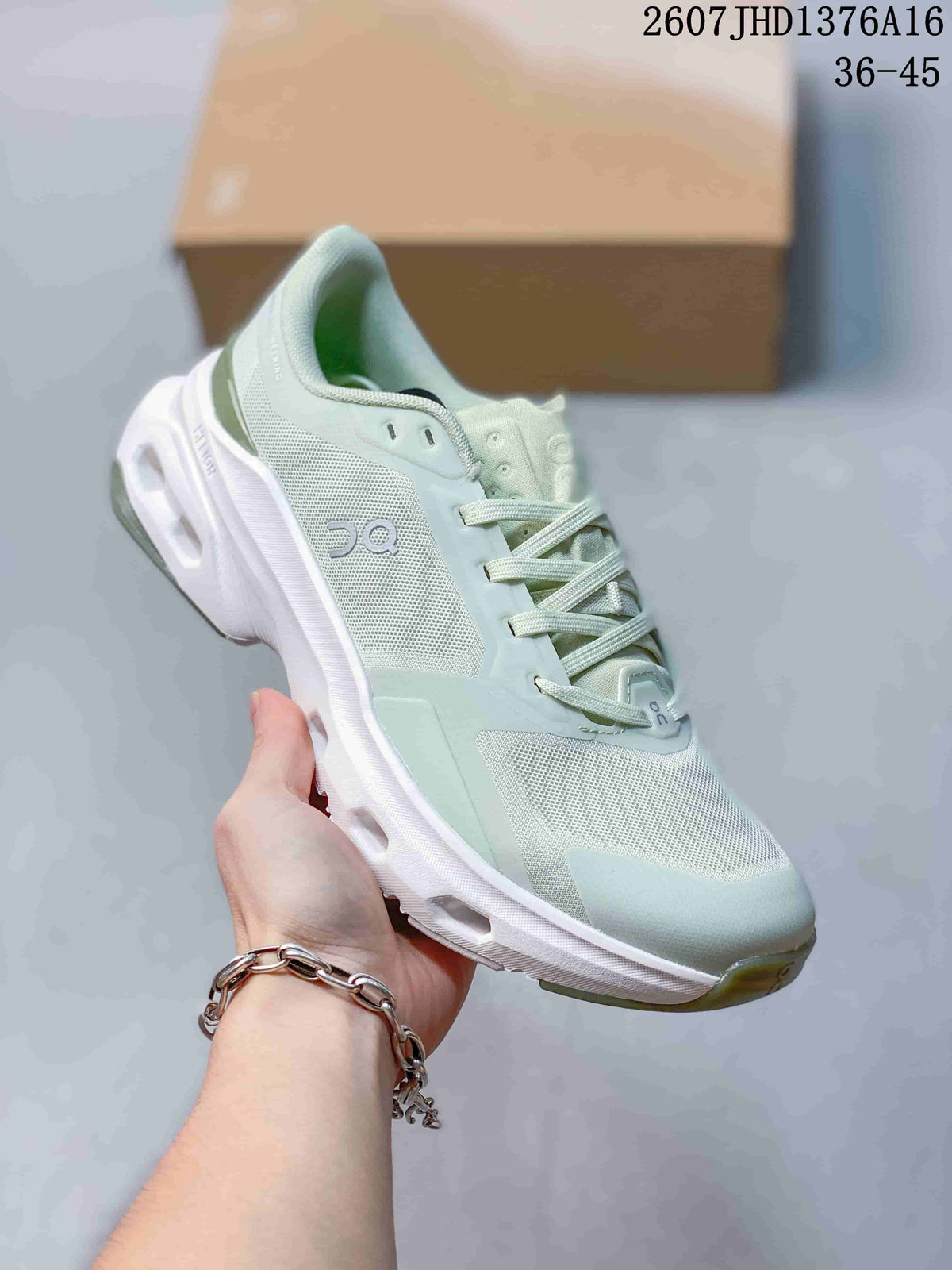 Three-quarter side view of a pale mint green and white On Cloudpulse 2 sneaker showing the On logo, lace-up construction, and sculpted outsole.