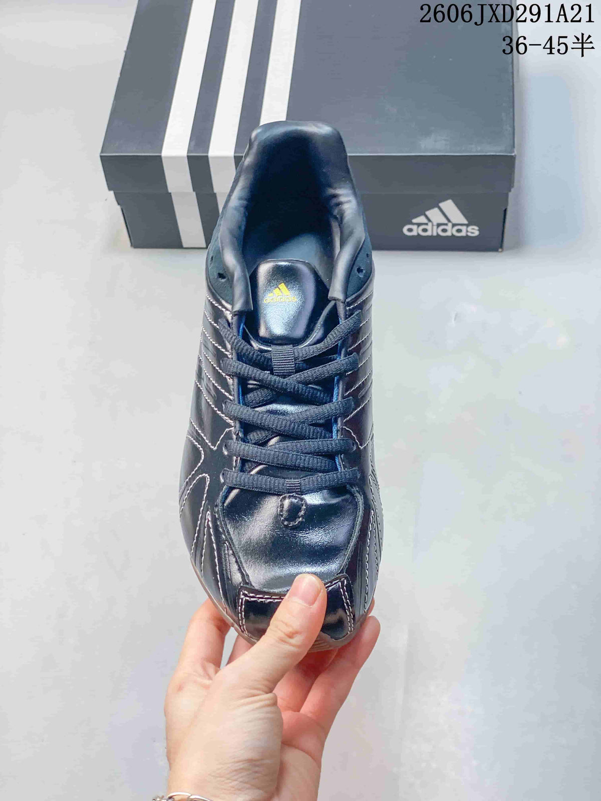 Top view of the lace-up dark navy sneaker with padded tongue and Adidas branding.