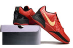 Red, black, and gold Ja 2 shoes displayed on and beside a shoe box.