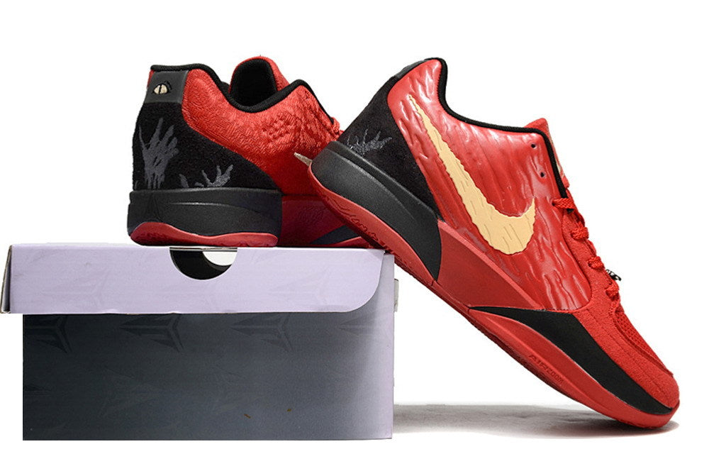 Red, black, and gold Ja 2 shoes displayed on and beside a shoe box.