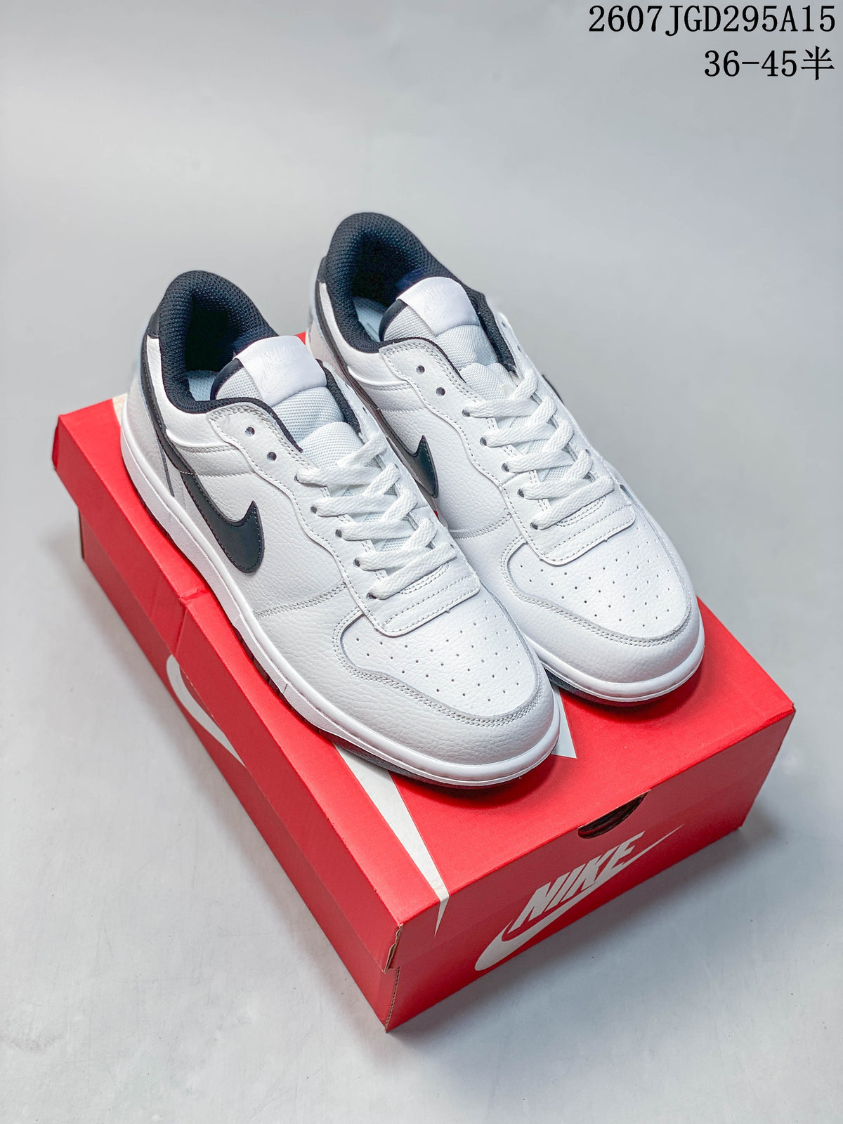 Pair of white and black Nike SB Dunk Low Pro sneakers displayed on a red shoebox; image text shows style code 2607JGD295A15 and size range 36–45.5.