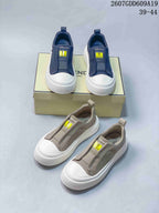 Navy and taupe Fendi slip-on sneakers shown together from above and at an angle, with logo patches and white soles visible; image text lists style code 2607GDD609A19 and sizes 39–44.