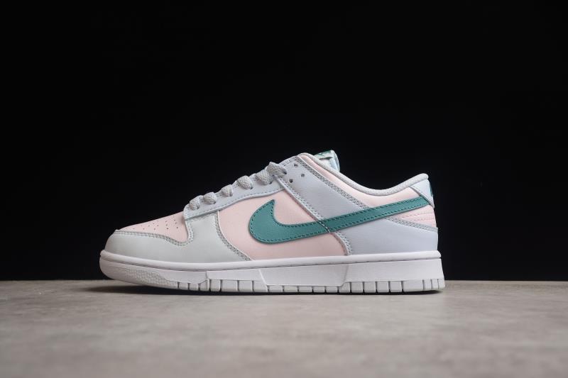 Side profile of the sneaker showing the pale pink upper, white overlays and green Swoosh.