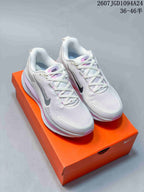 Pair of white and pink Nike Vomero 18 SE sneakers displayed on an orange Nike shoe box; source size range text is visible at the top.