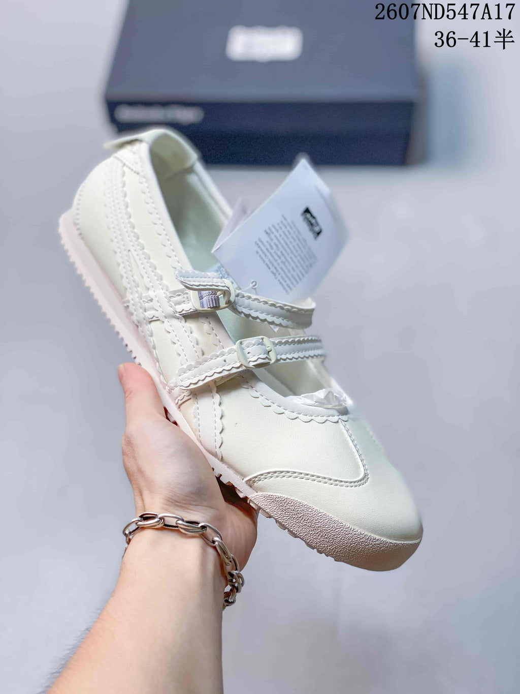 White Mary Jane sneaker with matching white straps, side stripes and a light sole.