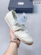 White Mary Jane sneaker with matching white straps, side stripes and a light sole.