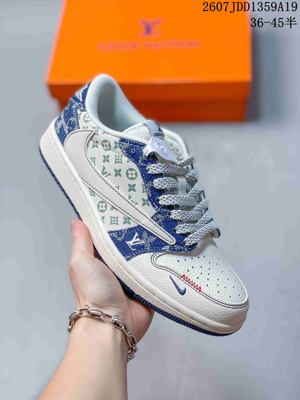 White and blue low-top sneaker showing patterned side panels, blue overlays, and contrasting laces.