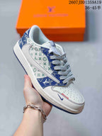 White and blue low-top sneaker showing patterned side panels, blue overlays, and contrasting laces.