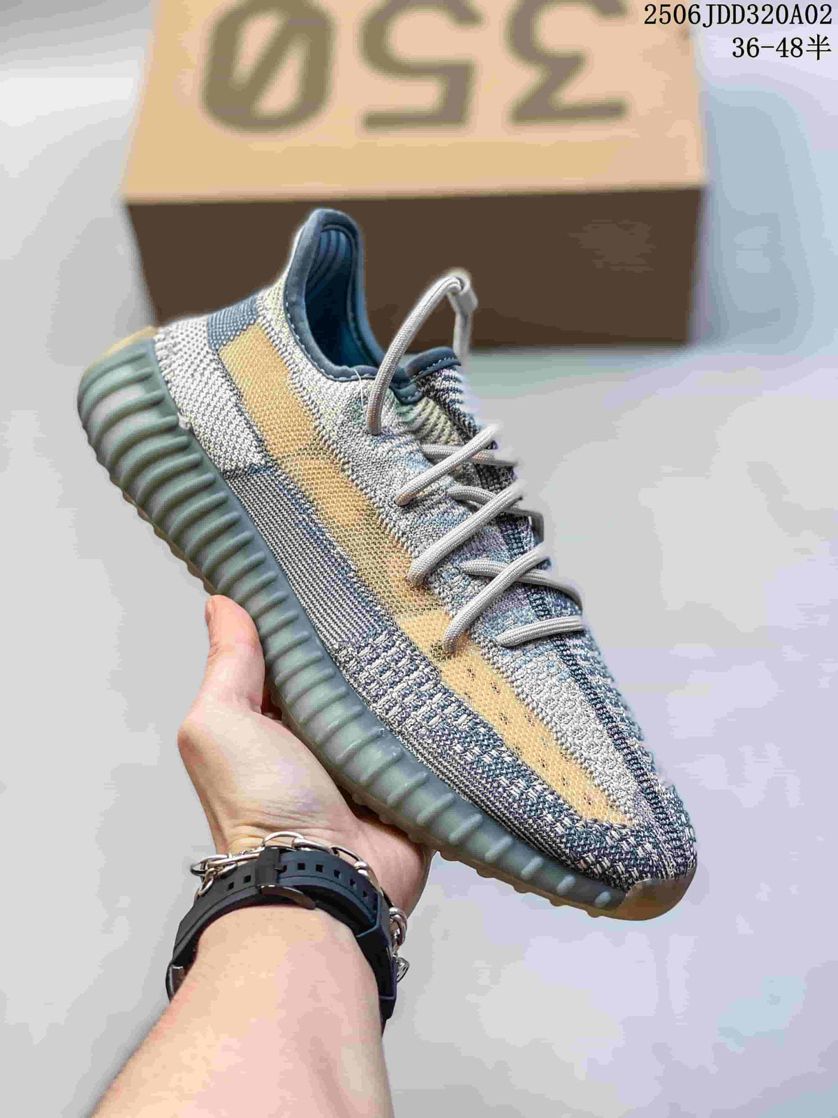 Multicolor knit sneaker with a pale side stripe, gray laces and a ribbed sole.