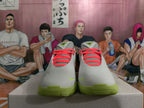 Front view of grey Nike basketball shoes with coral laces and lime green soles